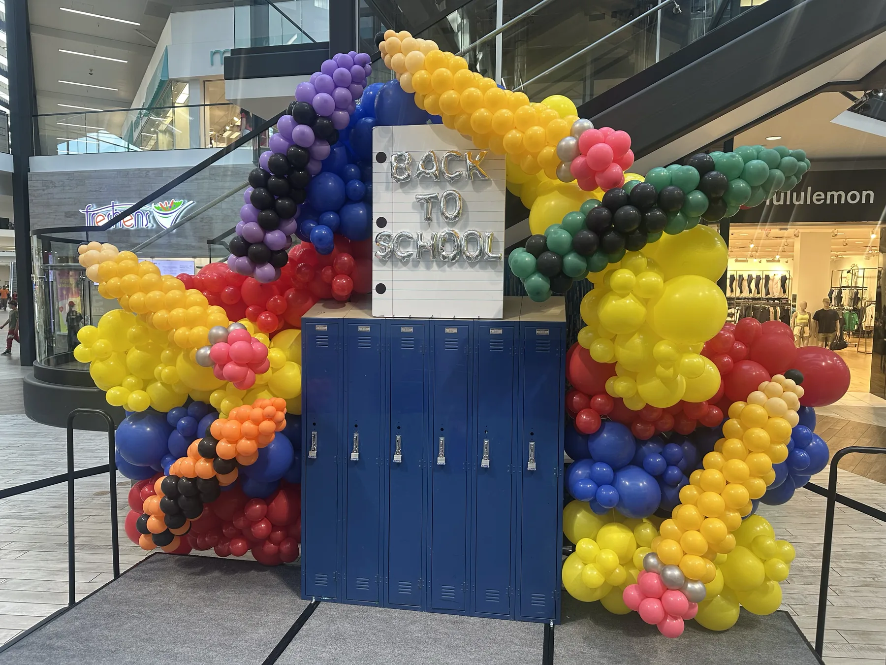 Large back-to-school balloon stage installation